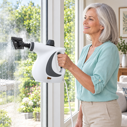 Older woman cleaning a glass window with the white steam cleaner